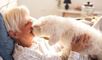 Resident_in_bed_with_their _companion_dog