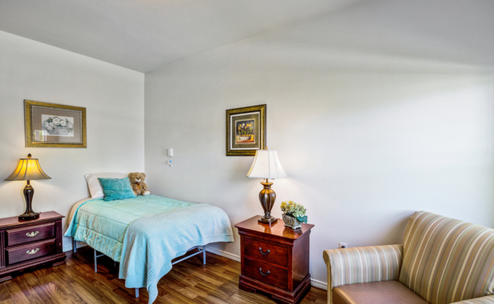 Bedroom with single bed and chair