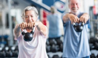 A woman and man taking part in a senior fitness class Paradise Village - San Diego - Generations LLC