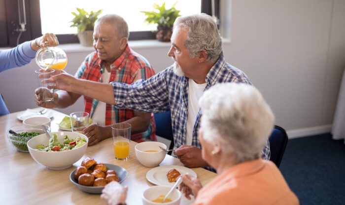 3 people enjoy a meal together