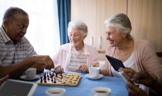 A group of elderly women playing chess