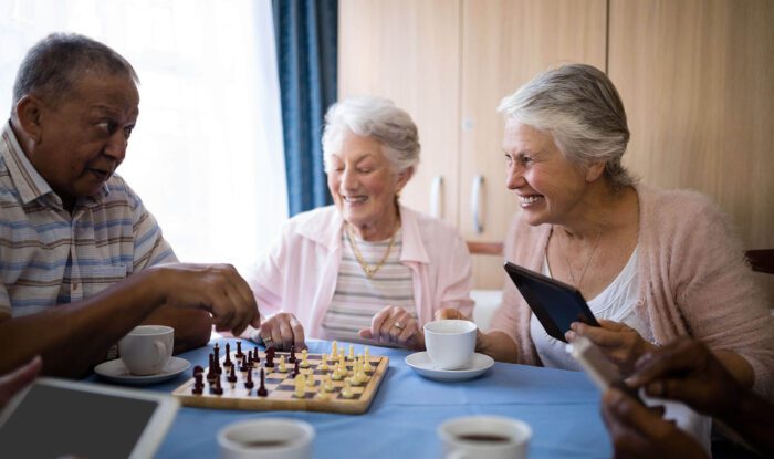 A group of elderly women playing chess
