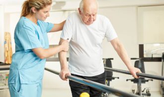 an elderly man has a caretaker help him with physical therapy - Post-Acute Care at Generations LLC