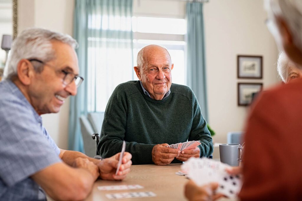 3 elderly men enjoy each others company independent living