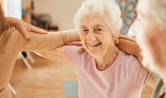 A old woman smiles in memory care